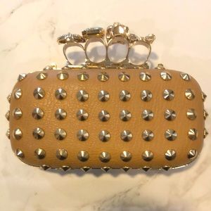Camel and gold clutch with “brass knuckles”
